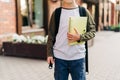 Back to school. Cute child with backpack holding notepad and training books going to school. Boy pupil with bag Royalty Free Stock Photo