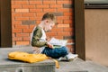 Back to school. Cute child with backpack, holding notepad and training books going to school. Boy pupil with bag Royalty Free Stock Photo