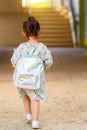 Back to school. Cute little child girl with backpack running and going to school with fun. Royalty Free Stock Photo