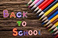 Back to School desk table top view, words on grunge old wooden board background. Education concept. Time for learning. Royalty Free Stock Photo