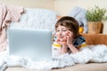 Back to school. Distance learning online education. Caucasian smile preschooler kid boy studying at home with laptop notebook and Royalty Free Stock Photo