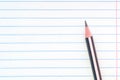 Back to school, education concept - close-up striped pencil on notebook lined paper background for educational new academic year