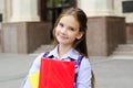 Back to school. Education concept. Cute smiling schoolgirl on the way to the school
