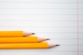 Back to school, education concept with orange pencils close up and composition book on background for educational new academic yea Royalty Free Stock Photo