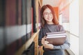 Back to school education knowledge college university concept, Beautiful female college student holding her books smiling happily Royalty Free Stock Photo