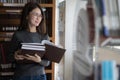 Back to school education knowledge college university concept, Beautiful female college student holding her books smiling happily Royalty Free Stock Photo