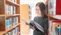 Back to school education knowledge college university concept, Beautiful female college student holding her books smiling happily Royalty Free Stock Photo