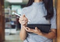 Back to school education knowledge college university concept, Beautiful female college student holding her tablet smiling happily Royalty Free Stock Photo