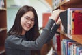 Back to school education knowledge college university concept, Beautiful female college student holding her books smiling Royalty Free Stock Photo