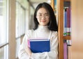 Back to school education knowledge college university concept, Beautiful female college student holding her books smiling happily