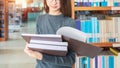 Back to school education knowledge college university concept, Beautiful female college student holding her books smiling happily Royalty Free Stock Photo