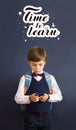 Back to school. Education. A little boy with a backpack. Schoolboy with telephone. Lettering Time to learn Royalty Free Stock Photo