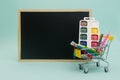 Back to school. Education, shopping office supplies for school with a school board on a blue background. Copyspace Royalty Free Stock Photo