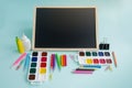 Back to school. Education, stationery and school board on a blue background. Copyspace Royalty Free Stock Photo