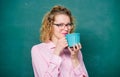 Back to school. Energy charge for whole day. Teacher eyeglasses drink coffee chalkboard background. Woman enjoy coffee