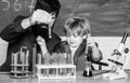 Back to school. Explaining biology to child. father and son at school. biotechnoloy research concept. Chemistry and