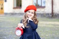 Back to school. first day of autumn. Little Girl and retro alarm clock. School years. time to go to school. Child education and sc Royalty Free Stock Photo