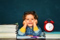 Back to school. Funny little boy pointing up on blackboard. Great study achievement.