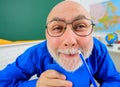 Back to school. Funny teacher preparing lesson. College lecturer in glasses with pencil. Learning and education. Royalty Free Stock Photo