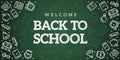 Back to school. Green blackboard background. School, office supplies. Doodle icons set and chalk inscription. Simple realistic Royalty Free Stock Photo