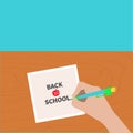 Back to school greeting card chalk text. Hand writing drawing pen. Girl holding pencil. Paper sheet. Wooden desk table. Body Royalty Free Stock Photo