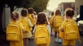 Back to school, group of female students with yellow backpack with textbooks, kickball. AI generated. Royalty Free Stock Photo