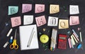 `Back to school` handwritten with school supplies on a black background. Top view. Royalty Free Stock Photo