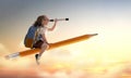 Child flying on a pencil Royalty Free Stock Photo