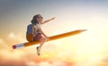 Child flying on a pencil Royalty Free Stock Photo