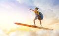 Child flying on a pencil Royalty Free Stock Photo