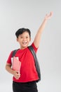 Back to school. Happy exciting child boy ready to study with backpack isolated on white. Kid win and jump with hand up