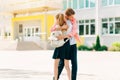 Happy kids are ready for elementary school, Happy classmates Boy and girl greet each other after quarantine, in the backyard Royalty Free Stock Photo