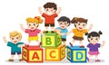 Happy school kids with alphabet blocks. Royalty Free Stock Photo