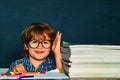 Back to school. Happy smiling pupils drawing at the desk. School kids. School or college pupil showing parents a test