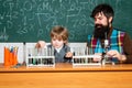 Back to school and happy time Happy smiling pupil and teacher drawing at the desk. Back to school and Education concept