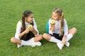 Back to school and healthy eating. Happy kids eat apples on green grass. Healthy school snack. School health. Dieting Royalty Free Stock Photo