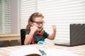 Back to school and home schooling. Happy school kid at lesson. Pupil in classroom at knowledge day. School time. Royalty Free Stock Photo