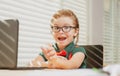 Back to school and home schooling. Happy school kid at lesson. Pupil in classroom at knowledge day. School time. Royalty Free Stock Photo