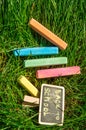 Back to school, the inscription on the mini-Board, the layout of the Board and chalk on the green grass, the concept of Royalty Free Stock Photo