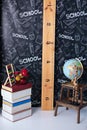 Back to school. Interior of elementary school. Chalkboard, Books, globe and stationery on classroom. Teachers Day concept. Empty c