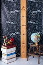 Back to school. Interior of elementary school. Chalkboard, Books, globe and stationery on classroom. Teachers Day concept. Empty c