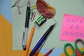 Back to school. Items for the school on a blue wooden table.