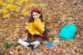 back to school. kid with notebook. fall season fashion. teen girl in uniform hold autumn leaves. Royalty Free Stock Photo