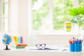 Back to school. Kids desk with books, globe Royalty Free Stock Photo