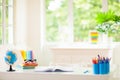 Back to school. Kids desk with books, globe Royalty Free Stock Photo