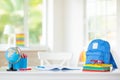 Back to school. Kids desk with books, globe Royalty Free Stock Photo