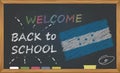 Back to school with learning and childhood concept. Banner with an inscription with the chalk welcome back to school and the Hondu