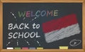 Back to school with learning and childhood concept. Banner with an inscription with the chalk welcome back to school and the Indon