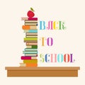 `Back to School` lettering. Many books on a school desk with an apple on top.