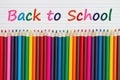 Back to School message with color pencils crayons on vintage ruled line notebook paper Royalty Free Stock Photo